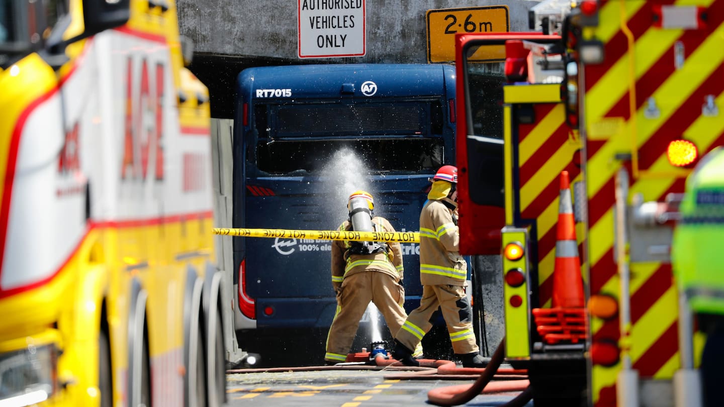 A bus has caught fire after getting stuck under an overpass at the Constellation Bus Terminal. Photo / Dean Purcell