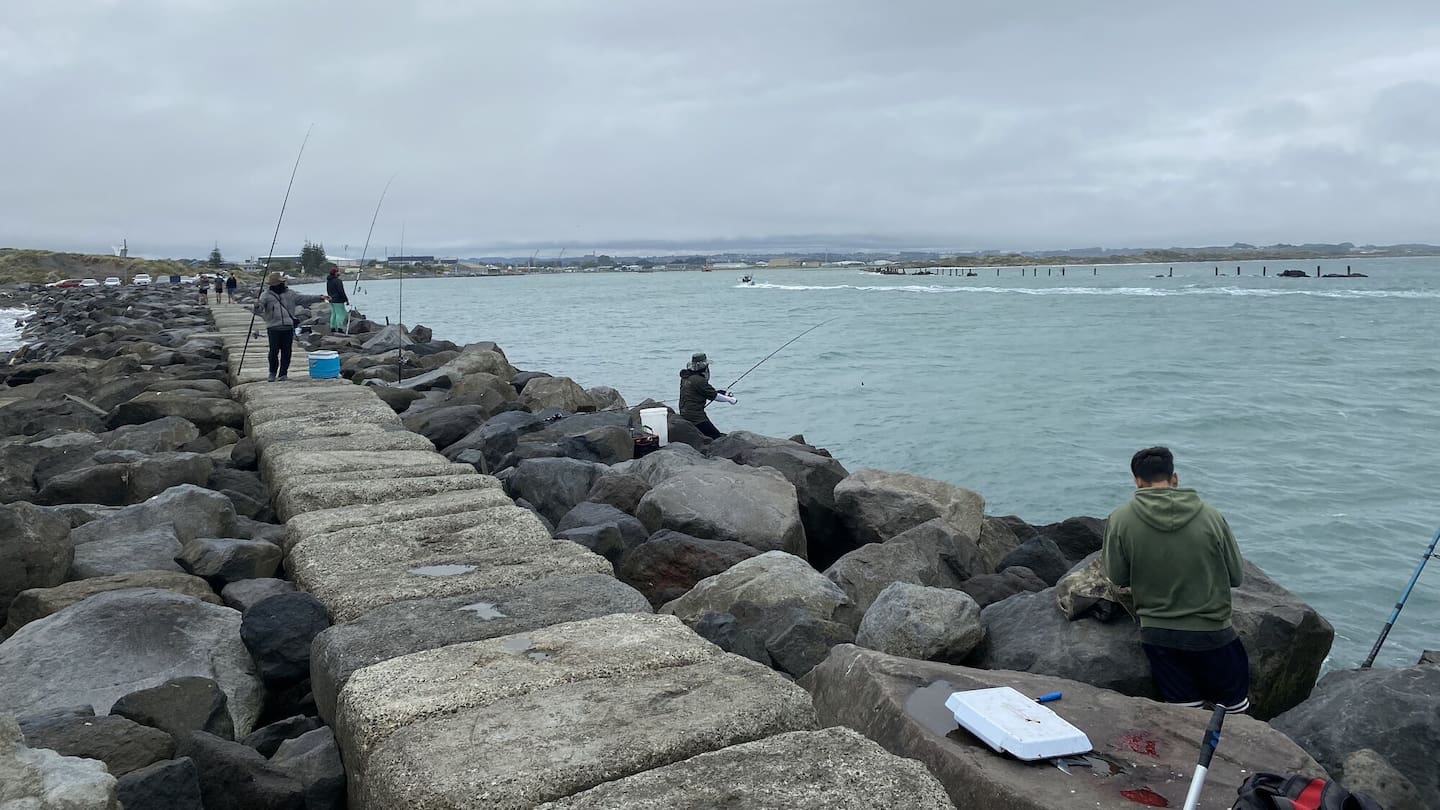 The North Mole in Whanganui has an abundance of keen fishers all year round. Photo / Fin Ocheduszko Brown