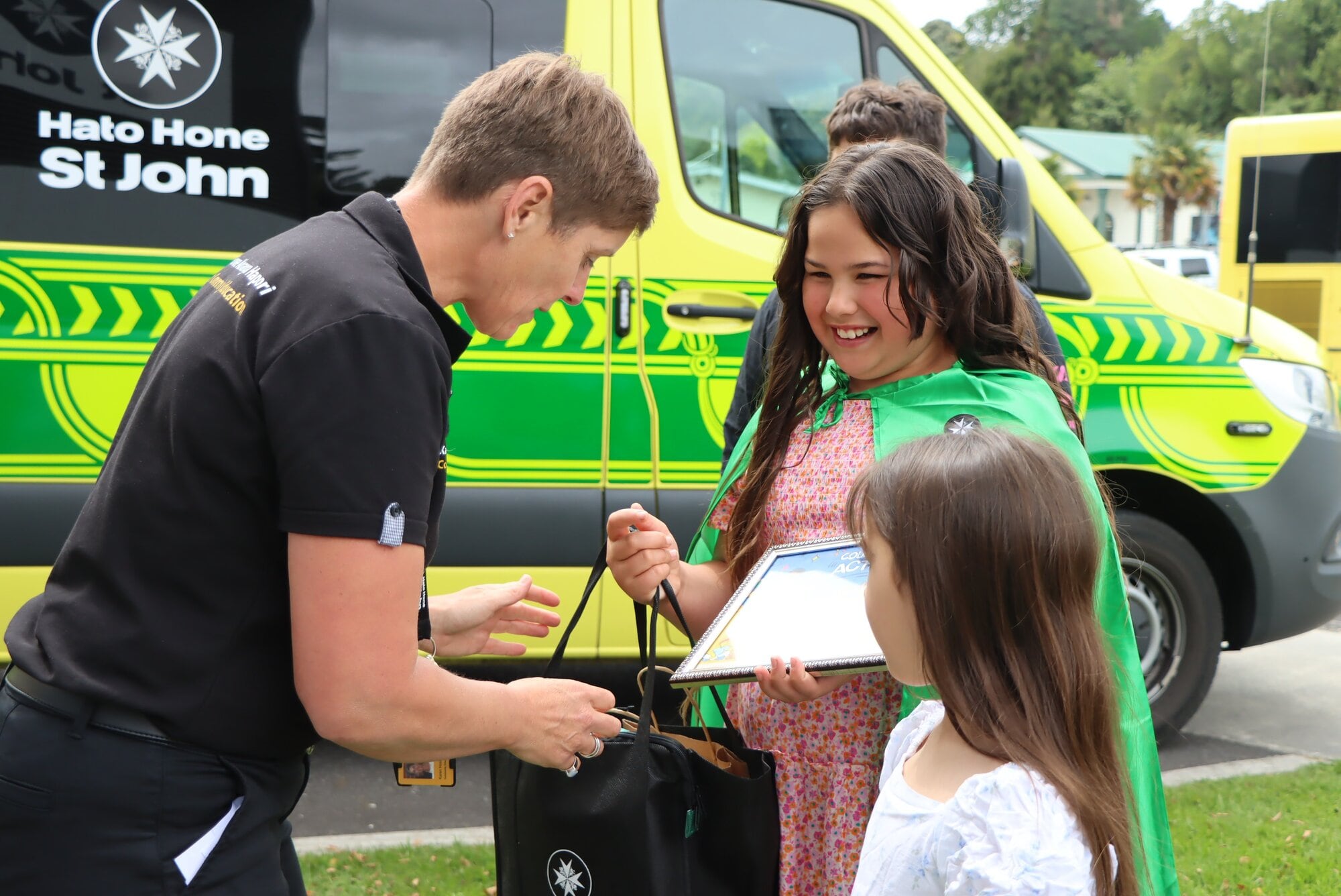 St John in Schools programme North Island community education lead Karen Hoskin with Kalia Saia and her sister Lyssi. Photo / Ayla Yeoman