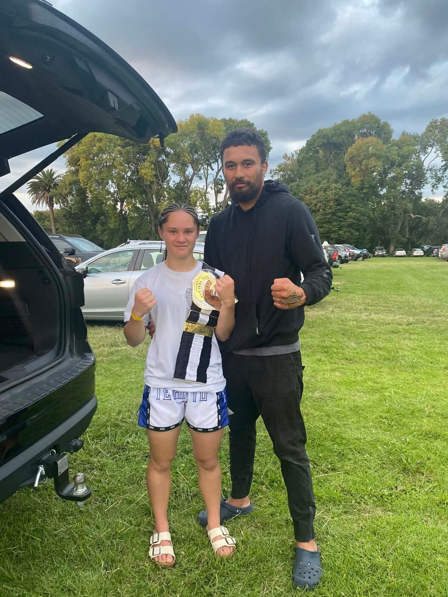  A proud moment after the fight, celebrating a hard‑earned win. Photo / Supplied
