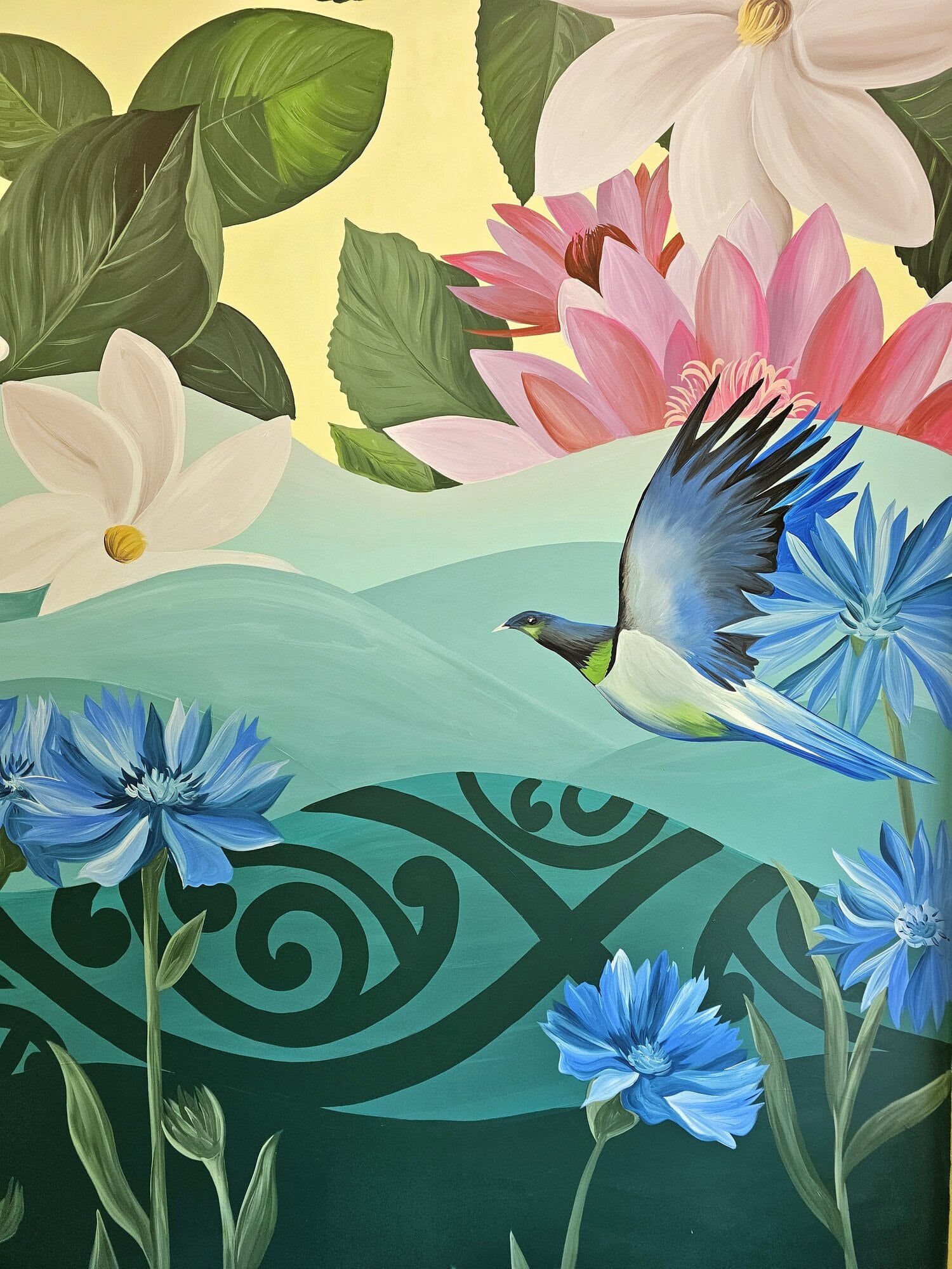  The mural features flowers representing various nationalities within the school as well as native birds, and also incorporates the school’s house colours.