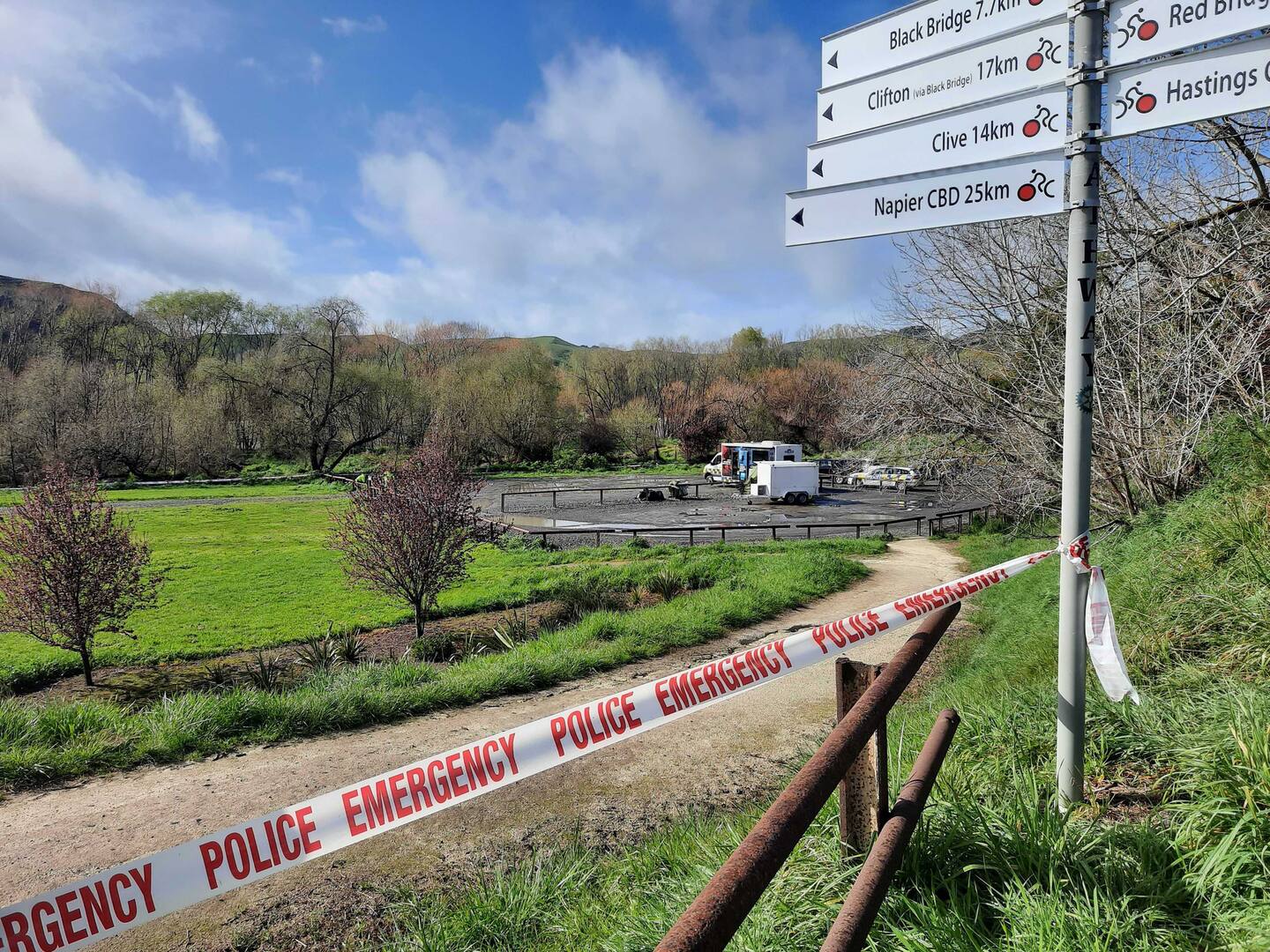 Police cordoned off the River Road Recreational Reserve once they realised the remains in the burned-out car were human. Photo / Neil Reid