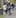 An armed police officer leads a man away following the incident. Photo / NZPA