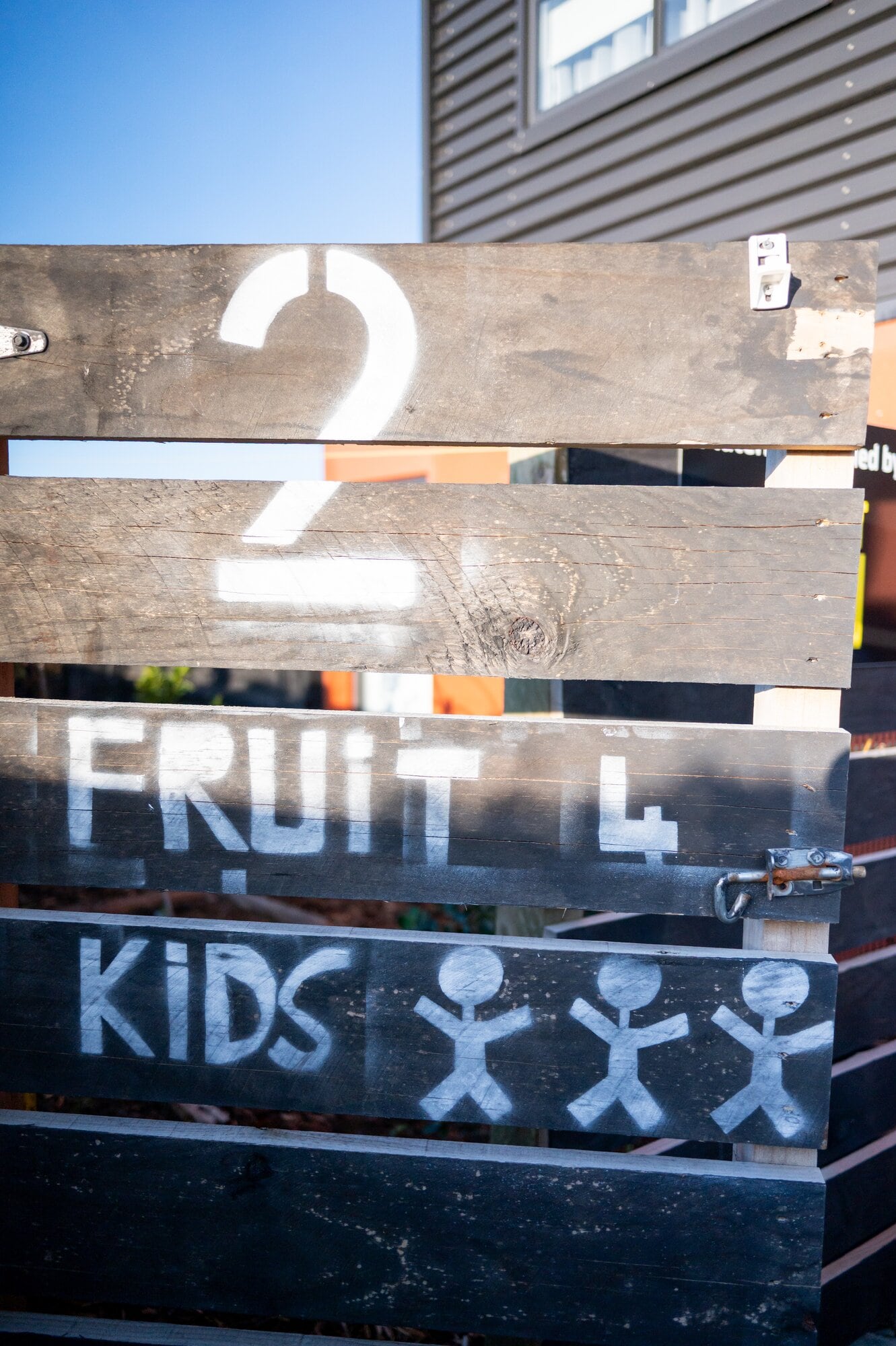  The orchard gate at Central Mews in Owens Place has a sign for children that reads 'Fruit 4 kids'. Photo / Brydie Thompson