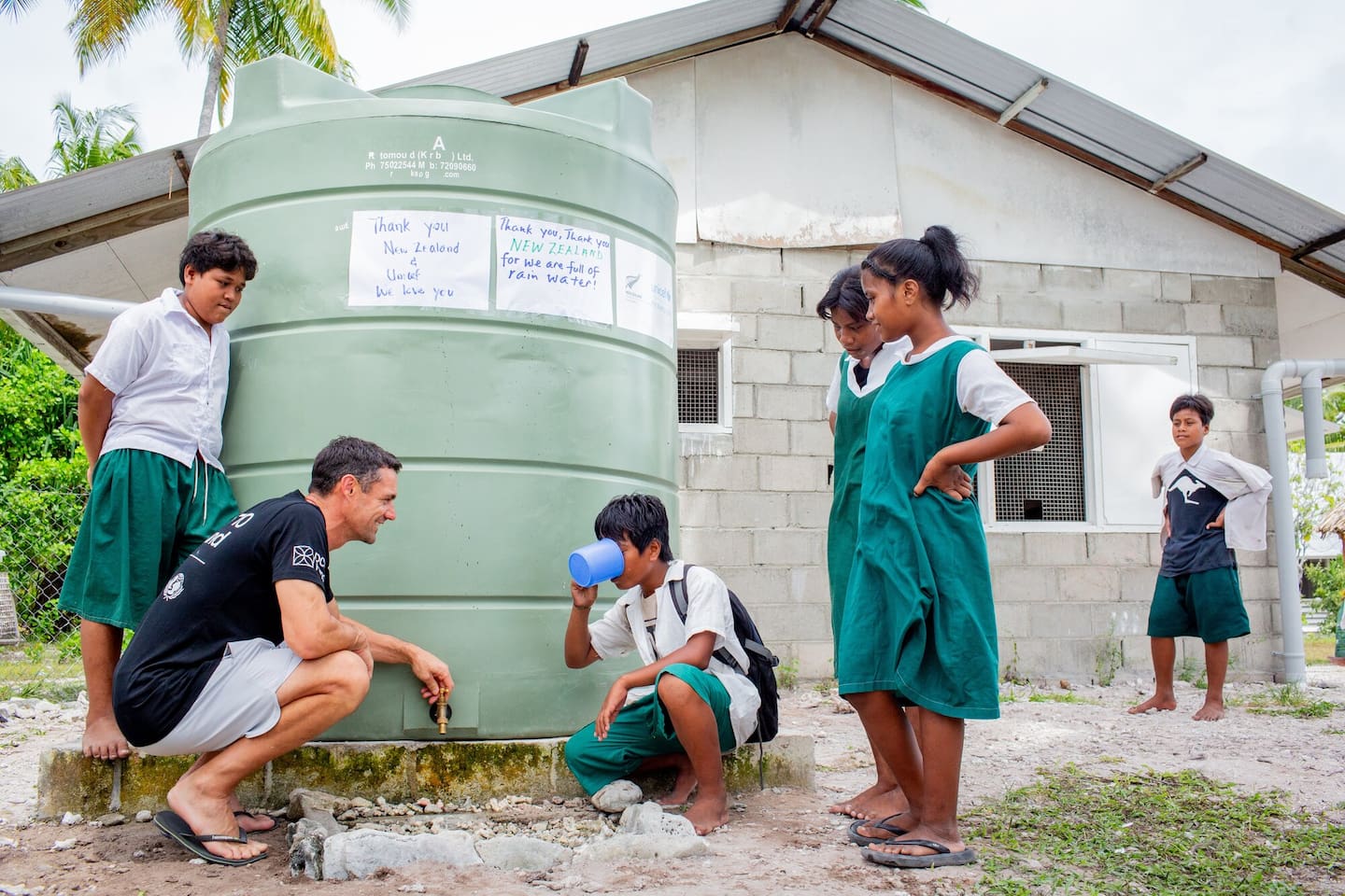 Dan Carter and pupils at Aoneta Junior Secondary School try clean drinking water. Photo / Unicef