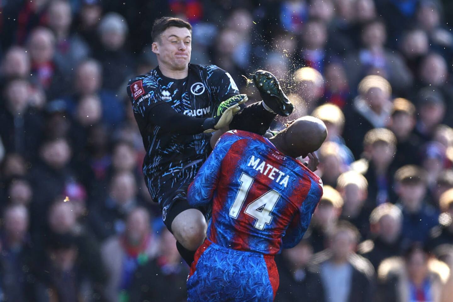 Millwall goalkeeper Liam Roberts karate kicks Jean-Philippe Mateta of Crystal Palace in the head. Photo / Getty Images