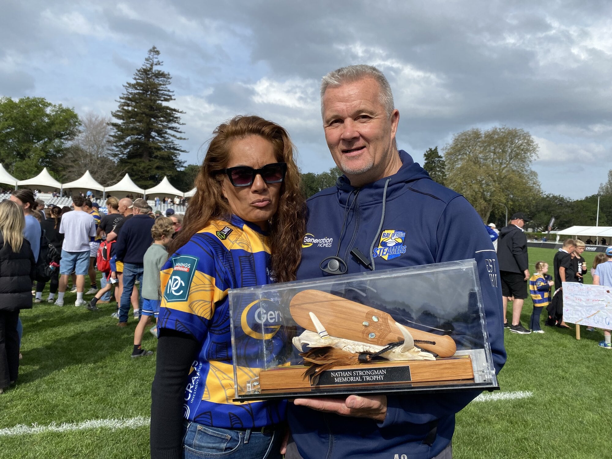 Bay of Plenty Steamers head coach Richard Watt, with wife Megan, holds the Nathan Strongman Memorial Trophy. Photo / Rosalie Liddle Crawford.