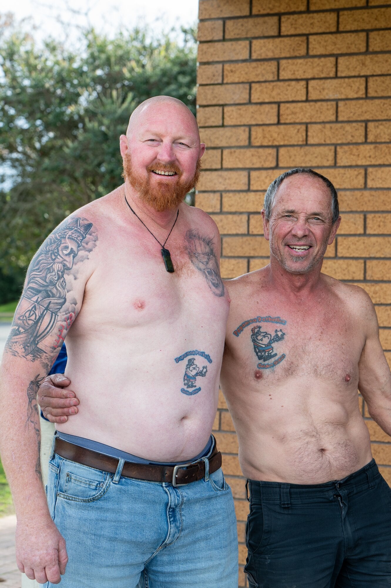 Glenn Ward (left) and Bill Lee with their Pāpāmoa Potbellez Golden Oldies logo tattoo. Photo / Brydie Thompson
