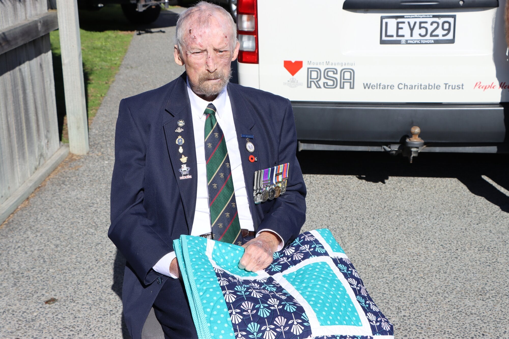  William Newell with his Anzac quilt. Photo / Ayla Yeoman