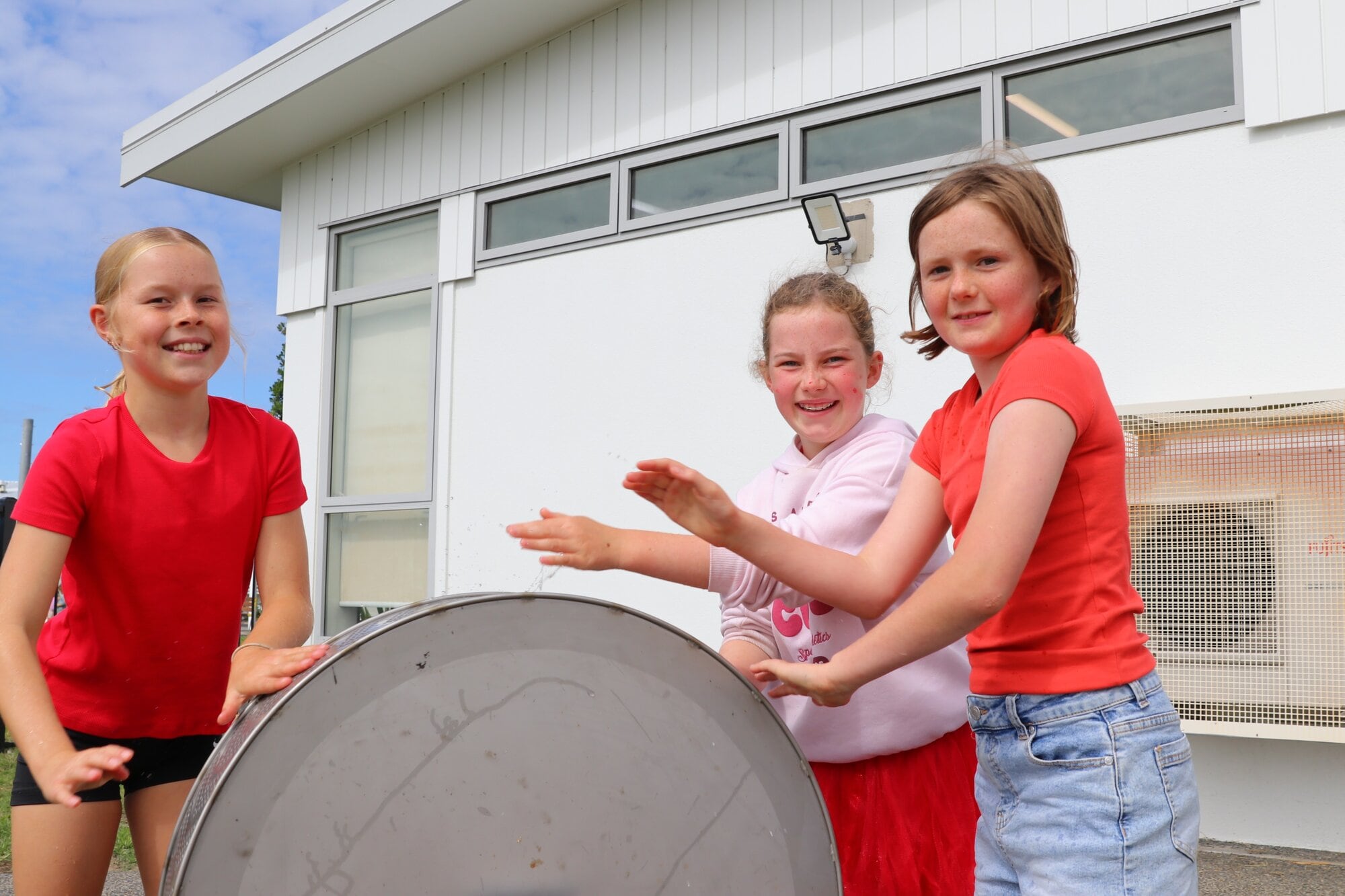  Ten-year-olds Mila Kinf, Jayne Corlett and Frankie Merry give the water wheel a spin. Photo / Kelly O&rsquo;Hara