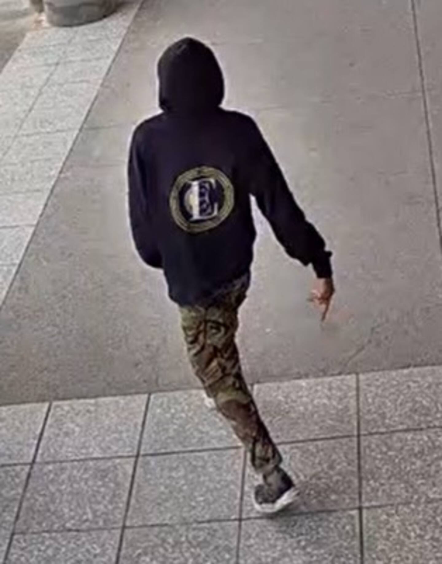 The man can be seen wearing a black or navy jumper, long cargo pants and sneakers. Photo / NZ Police