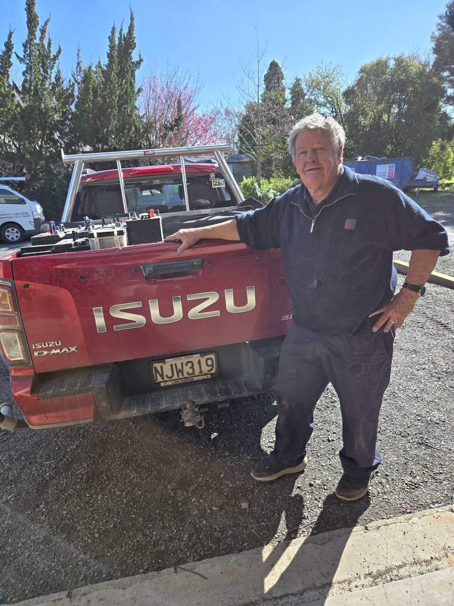  Allan Crapp loading batteries onto a ute for Katikati Rotary’s battery recycling project. Photo / Rod Calver