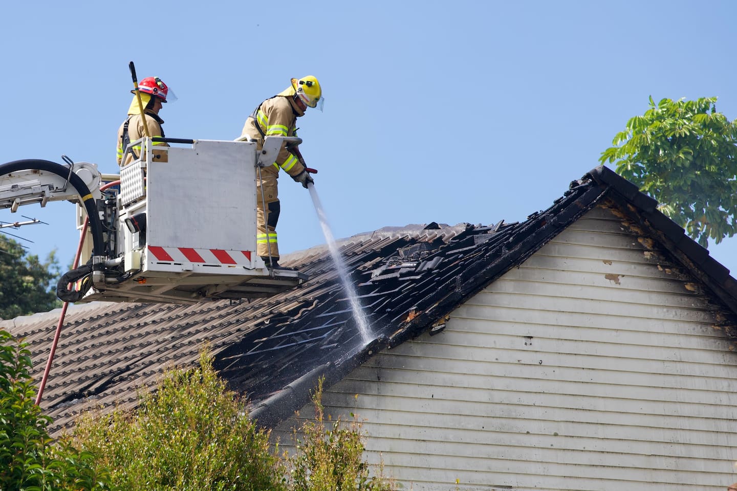 Crews work to extinguish a house fire in Ponsonby, Auckland. Photo / Jason Dorday