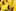 A girl in a yellow costume looks on during a procession as part of the Notting Hill Carnival's Children's Day. Photo / AP