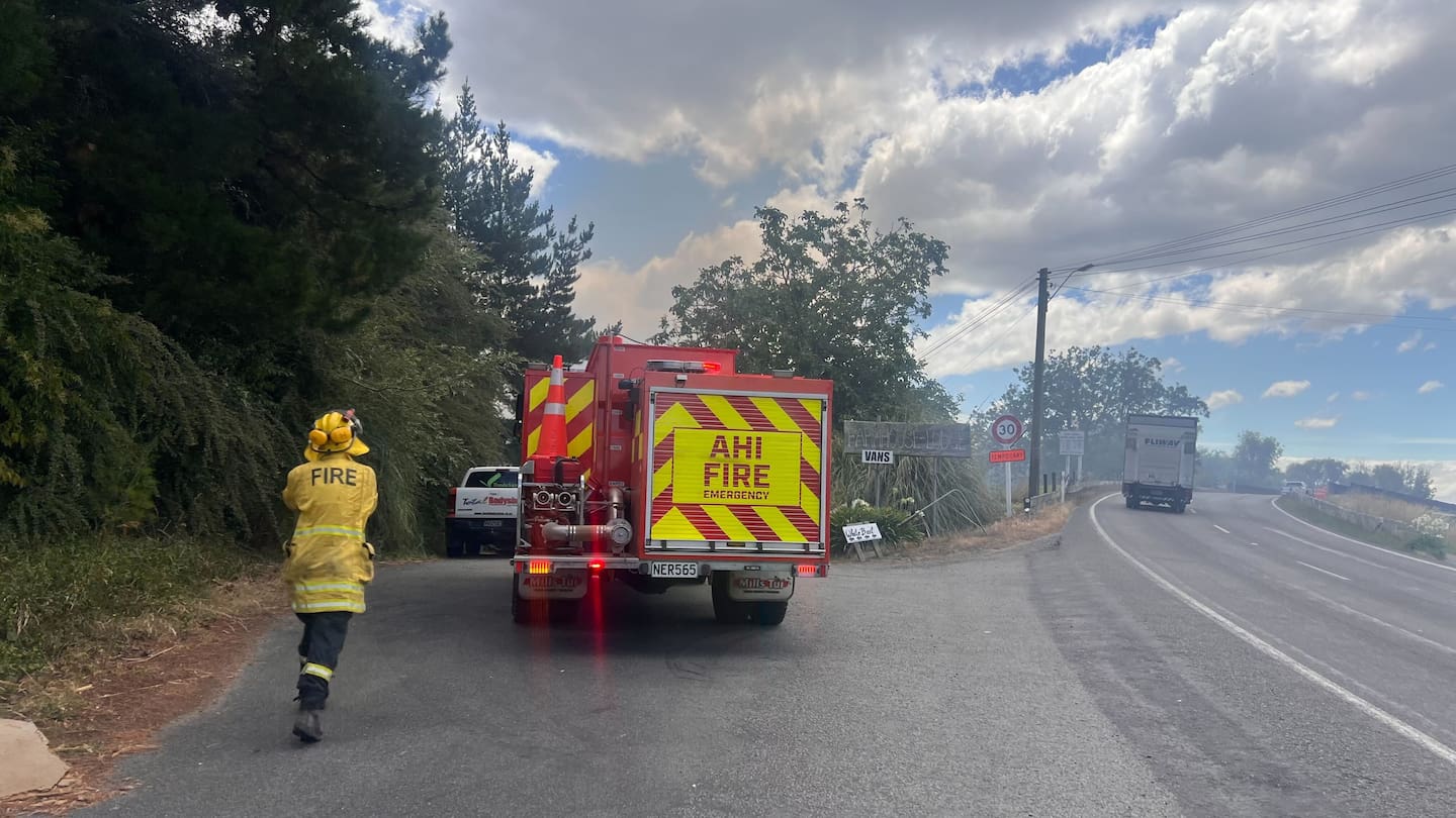 Firefighters parked beside the Ngaruroro River bridge at Fernhill. Photo / Rafaella Melo