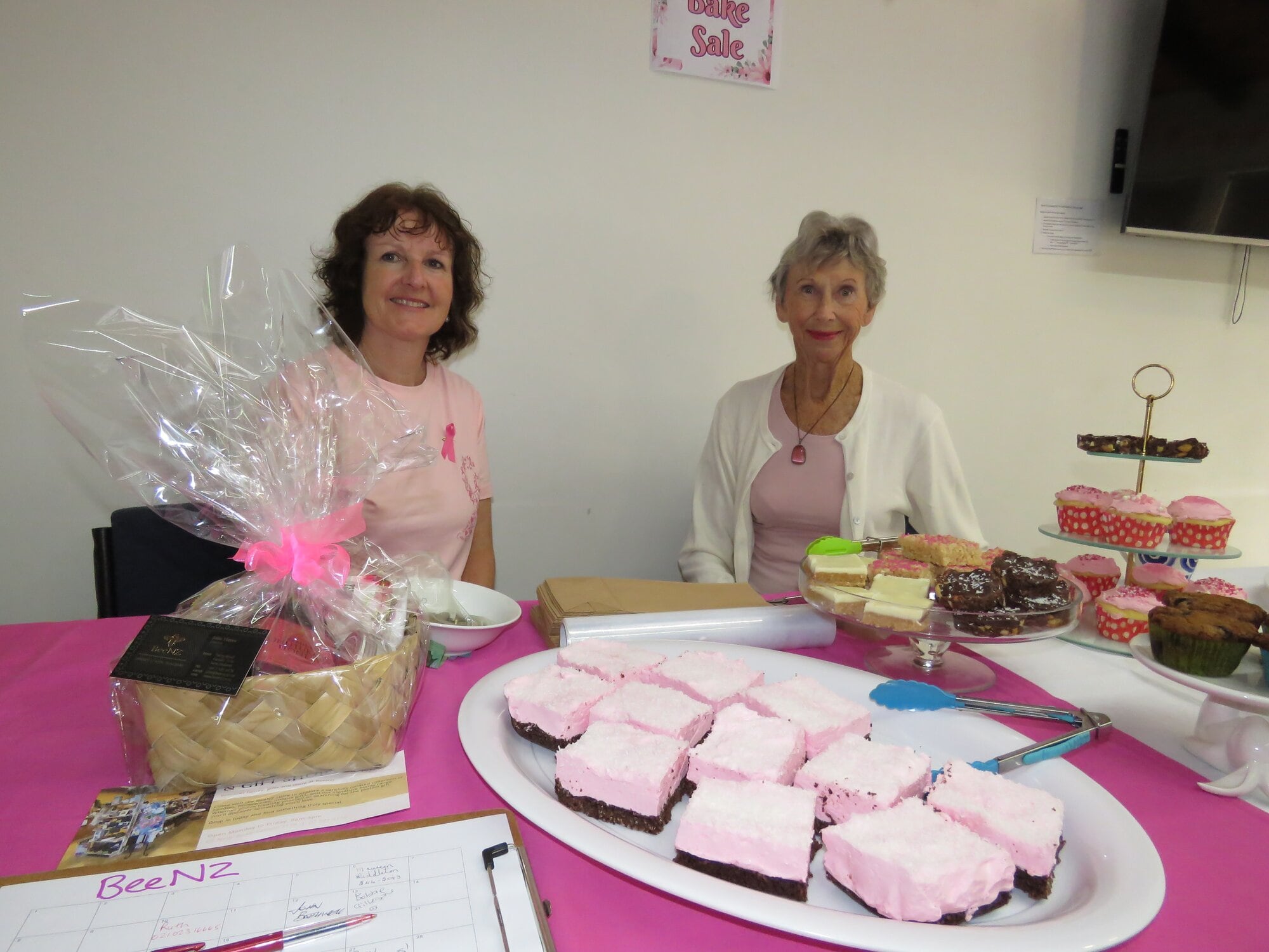 Katikati Community Centre staff member Sally Goodyear and volunteer Maureen McAllister kept busy selling raffle tickets and bake sale items. Photo / Merle Cave