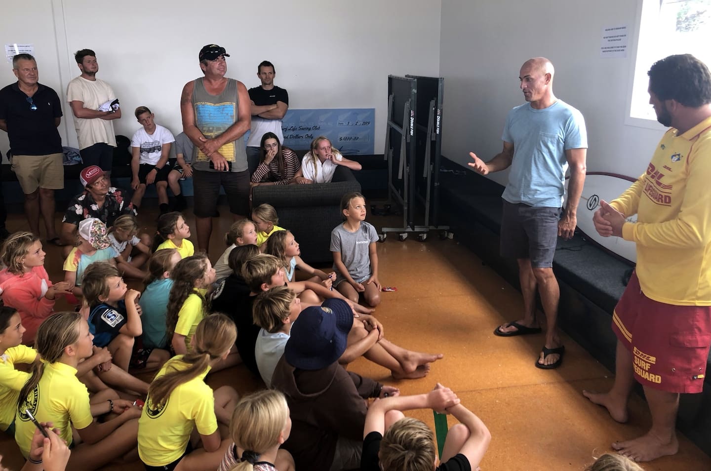 Kelly Slater visited Mangawhai Heads Volunteer Lifeguard Service in 2019, answering the questions of eager children and parents. Photo / Tony Baker