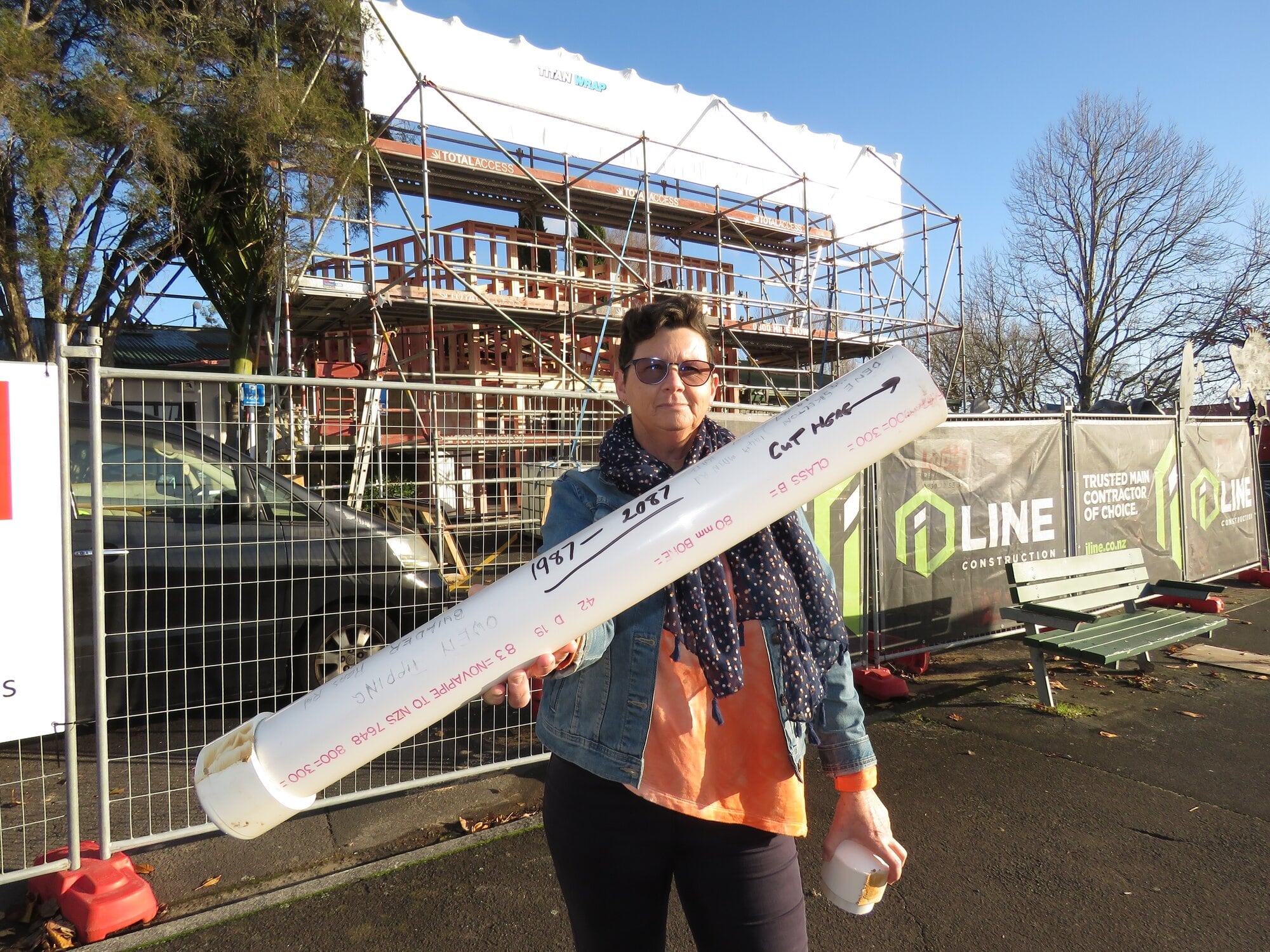 Kristin Crockett, of Katch Katikati, with the time capsule which was found inside the wall of her workplace, at The Arts Junction, formerly Katikati Library. Photo / Merle Cave