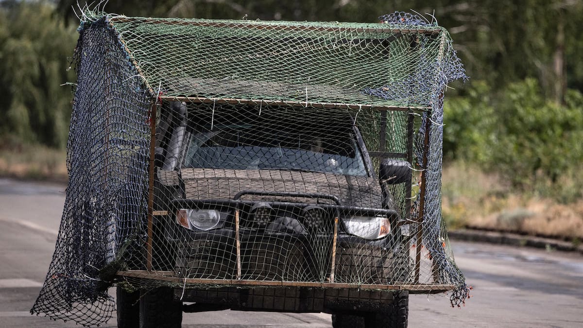 Ukraine’s low-tech solution to swarms of attack drones - vehicles and roads covered in fishing nets