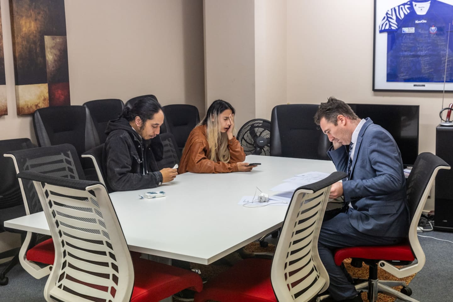 Celeste Howell and Anaru Mano discuss the investigation with their lawyer, Jamie McGilvary. Photo / Jason Dorday