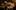 Anti-government protestors hold candles as they surround an Egyptian Army tank at Tahrir square in Cairo, Egypt. Protesters appear to have settled in for a long standoff, turning Tahrir Square into a makeshift village. Photo / AP
