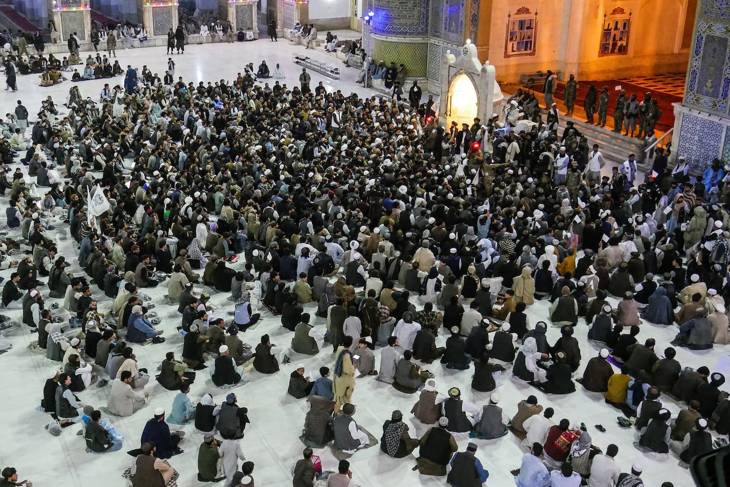 Afghan men gather after offering Tarawih prayers during the Islamic holy fasting month of Ramadan at Jami Masjid or the Great Mosque of Herat in Herat on Saturday to pledge solidarity to the Taliban amid their ongoing conflict with Pakistan. Photo / AFP