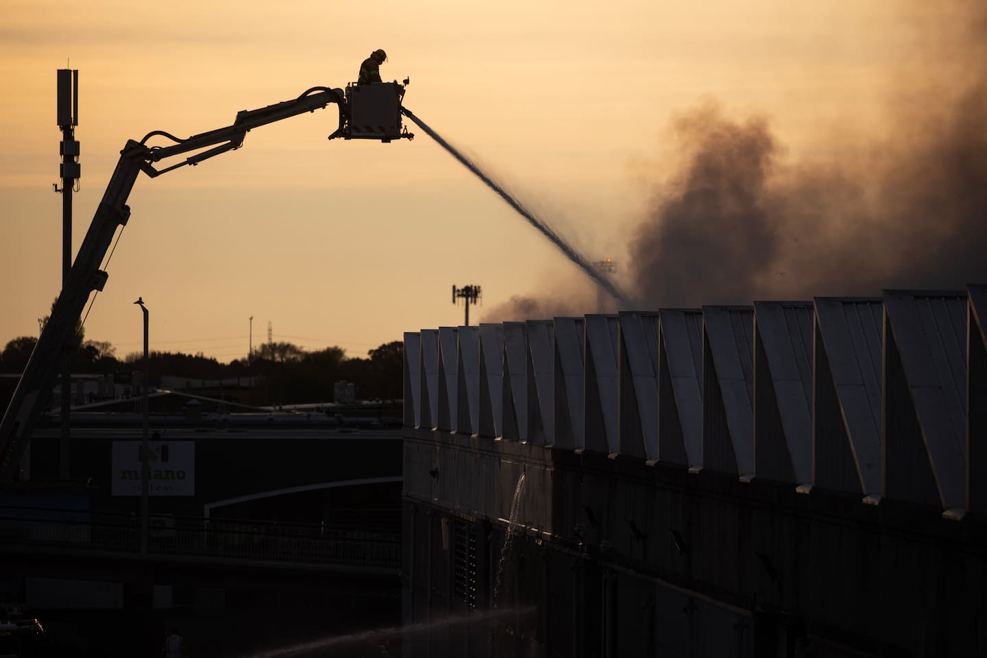 Efforts to control the large fire on Colombo Rd in Christchurch. Photo / George Heard