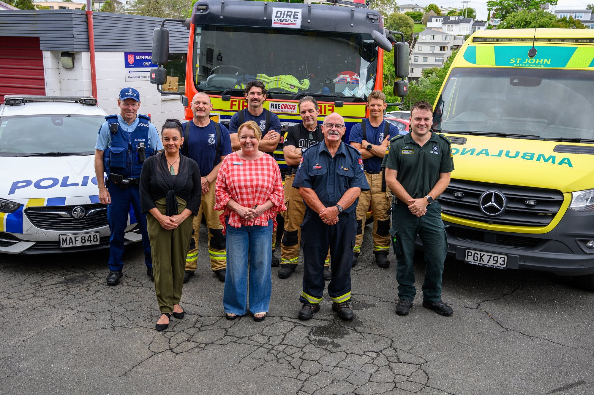 Back row: Mount Community Constable Mark Sanders with fire fighters Damian Cunniffe, Andrew Woodward, Neil Brown and Steve Opie. Front row: Salvation Army Community Ministries manager Sarah Way, Tauranga Foodbank manager Nicki Goodwin, Fire Emergency New Zealand Service Volunteer Support Office Robert Pinkerton, and Hato Hone St John Ambulance Watch Operations Manager Matt Hunter. Photo / David Hall