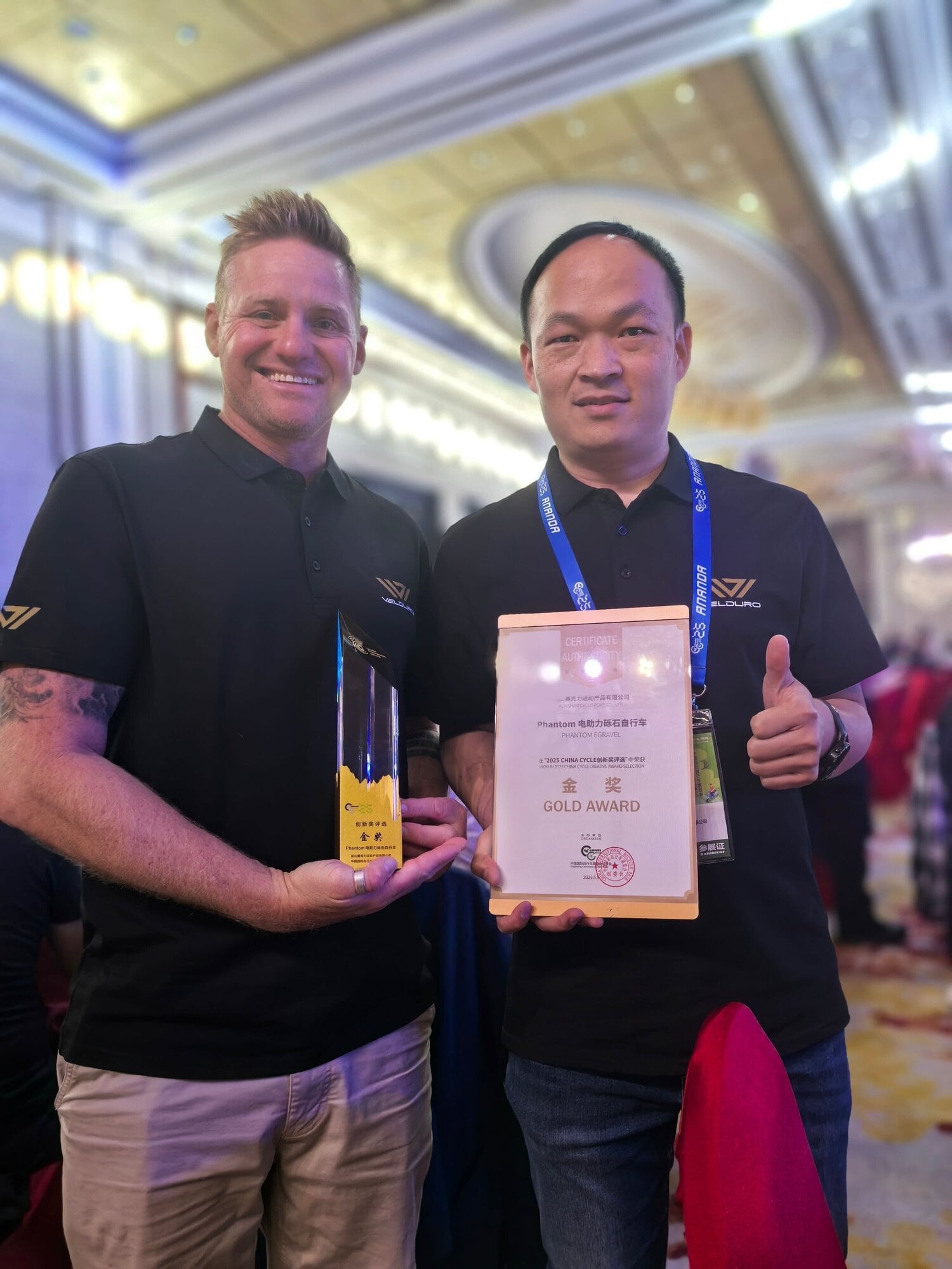Co-founder Dan Wallace (left) with business partner Dick Lai, after Velduro won gold at the opening awards of China Cycles 2025.