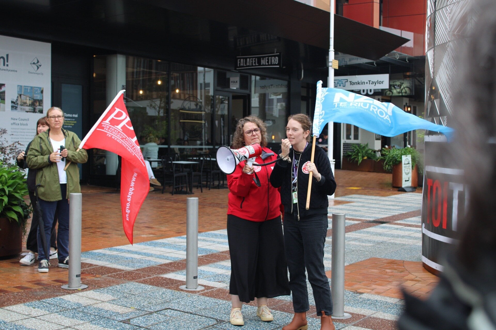 NZEI member Conor Fraser speaking at the Tauranga protest against the changes made to the Equal Pay Act. Photo / Ayla Yeoman