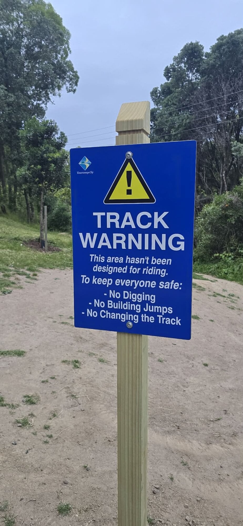 Tauranga City Council erected two warning signs at the top of the Pillans Rd Bike Track, with its future in doubt.