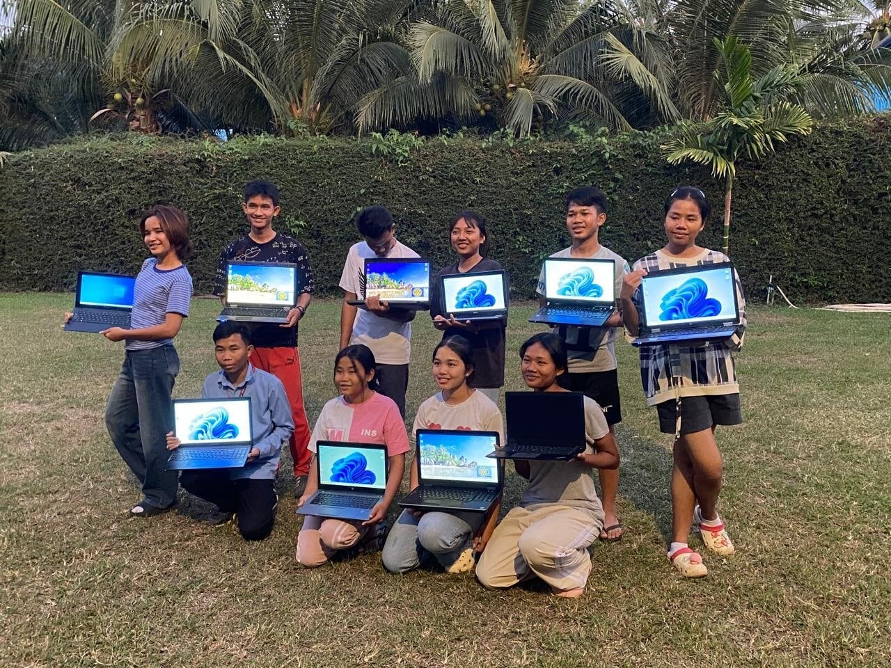 Students at Little Hearts school in Cambodia proudly show off their 10 laptops. Photo / Supplied