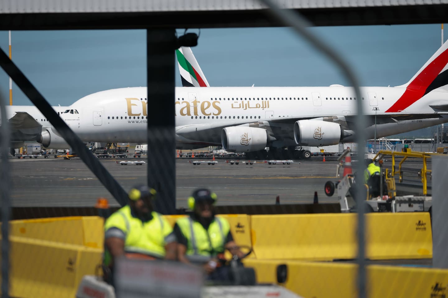 Emirates and Qatar Airways flights to and from Auckland have been grounded until further notice, with one Qatar Airways 777 and two Emirates A380s parked at Auckland Airport. Photo / Michael Craig