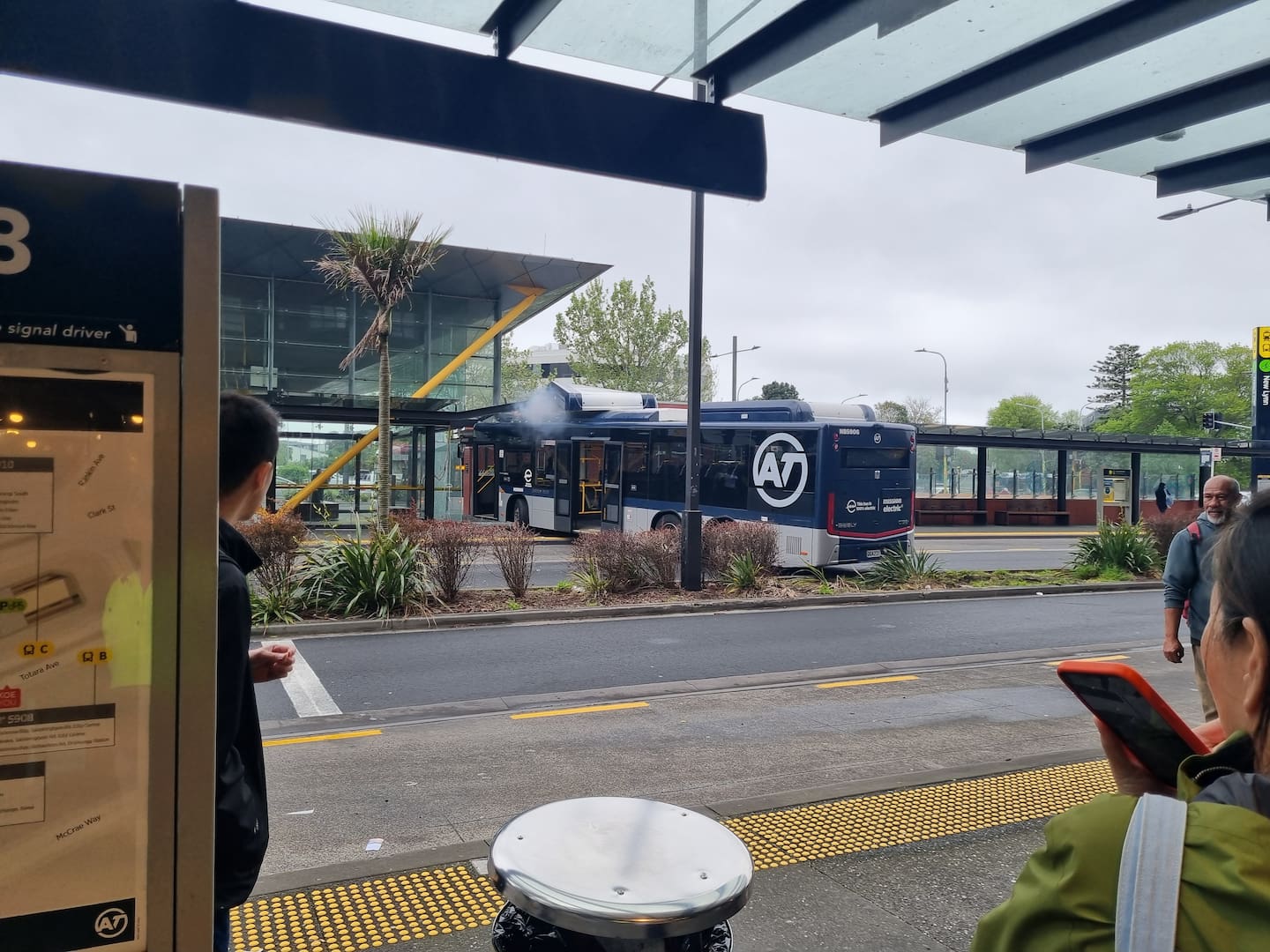 Smoke was seen coming from the battery compartment of the electric bus after crashed. Photo / Supplied
