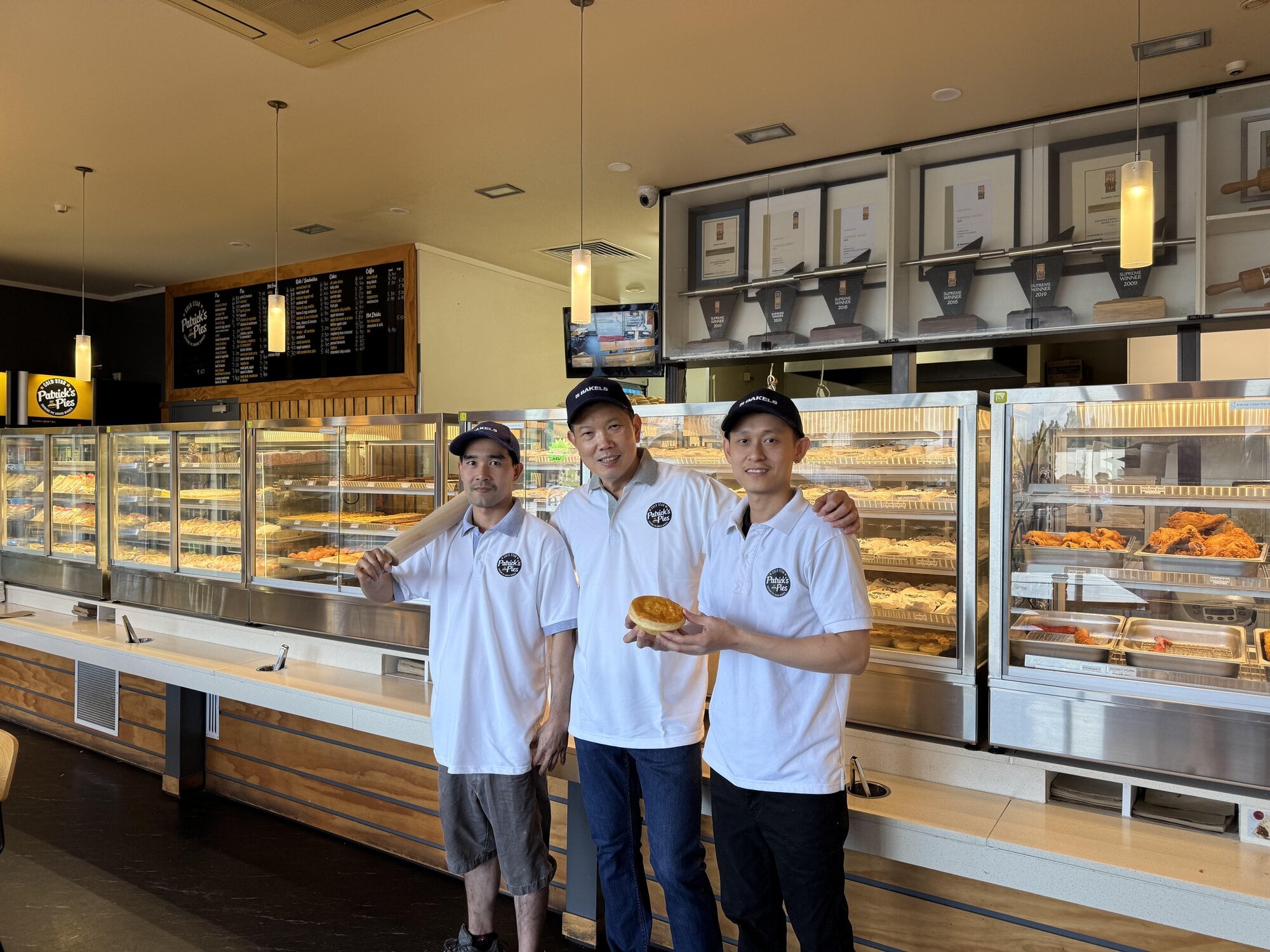  Srun Kéo, right, with fellow apprentice TayHak Hour, left, and Patrick Lam. Photo / Supplied