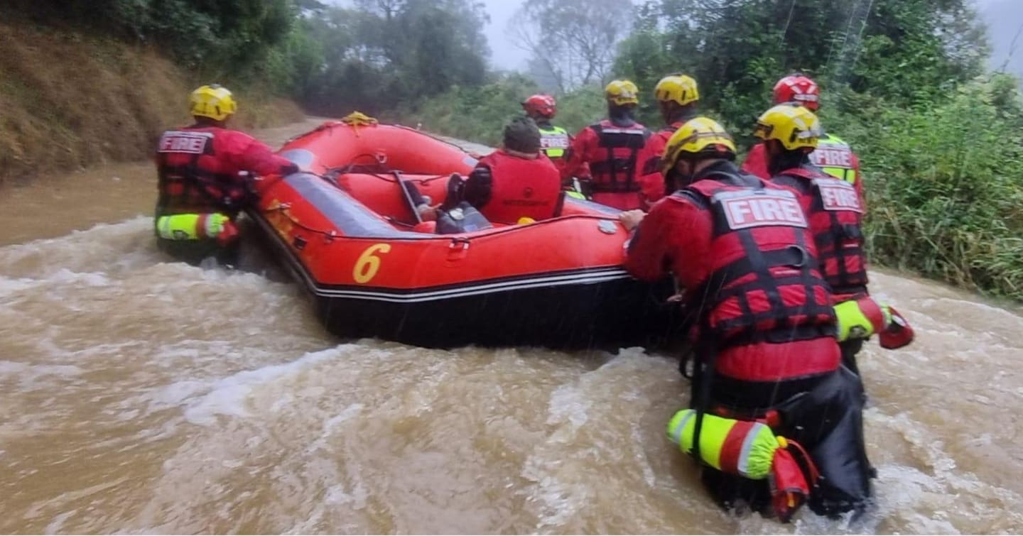 By the time the rescuers brought the woman to safety the water had risen to the top of her car's bonnet. Photo / Fire and Emergency NZ