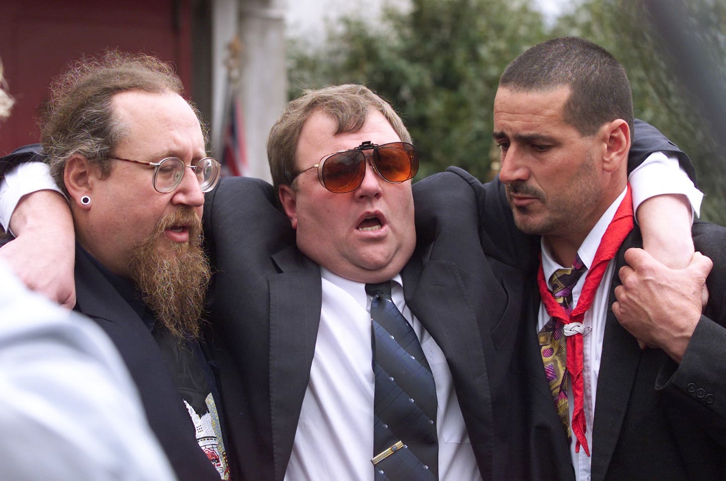 Mark Lundy being supported after the funeral of his wife Christine and daughter Amber in 2000. Photo / Mark Mitchell