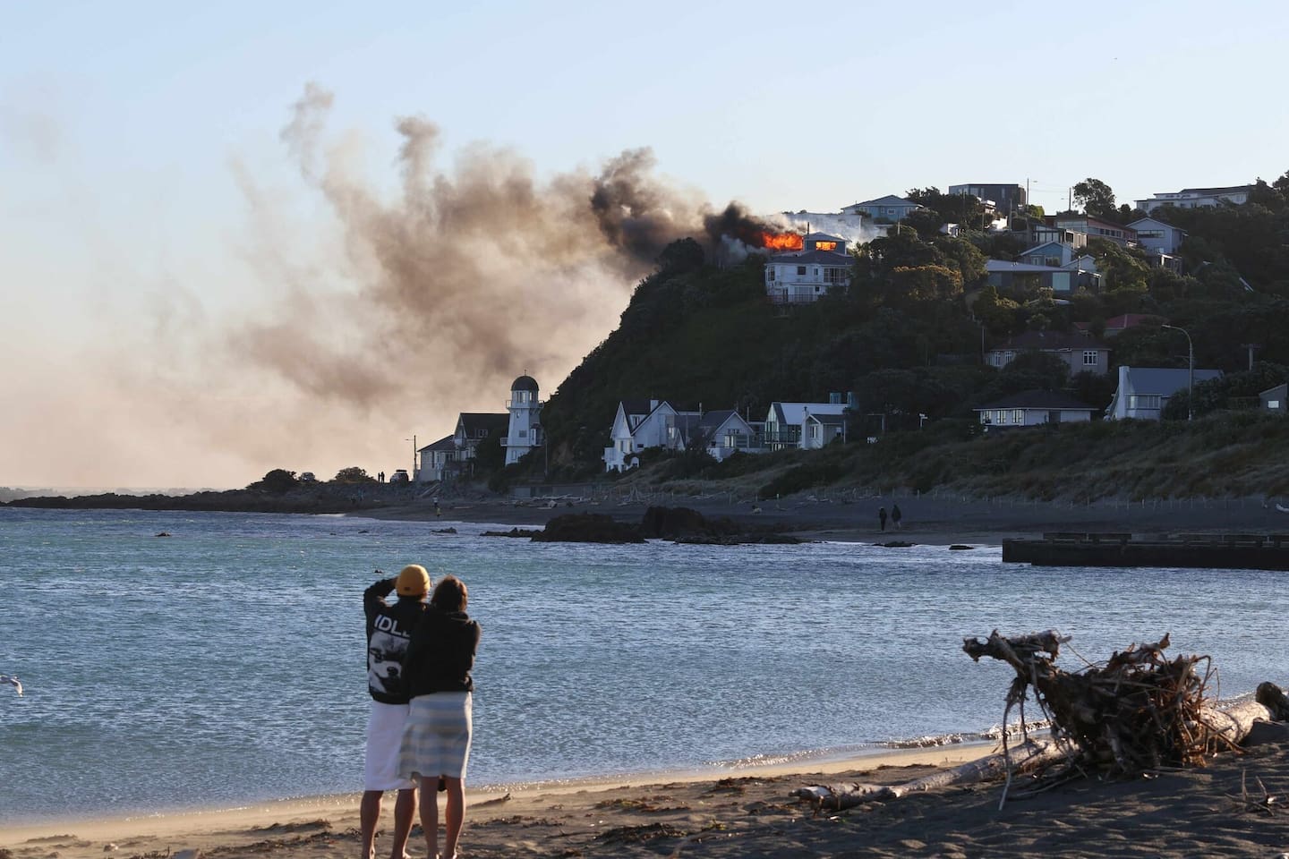 The blaze was visible across Island Bay. Photo / Blair Knuckey