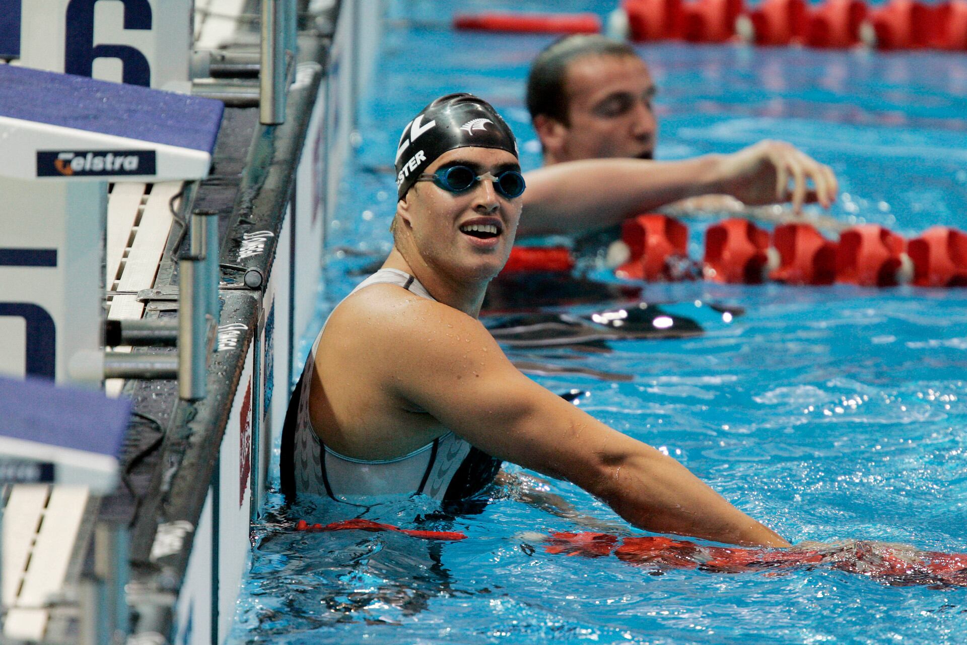 Moss Burmester looks to the fans after claiming bronze in the Men's 100m butterfly at the 2006 Commonwealth Games in Melbourne. Photo / NZPA