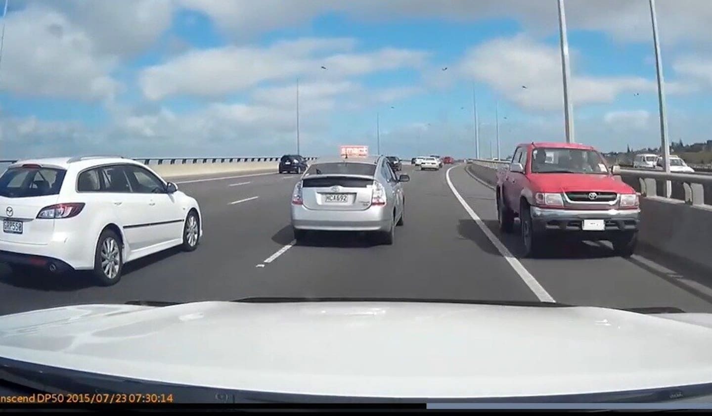 A man later identified as Kingi Karanga is pictured driving a stolen red ute the wrong way along an Auckland motorway in October 2017.