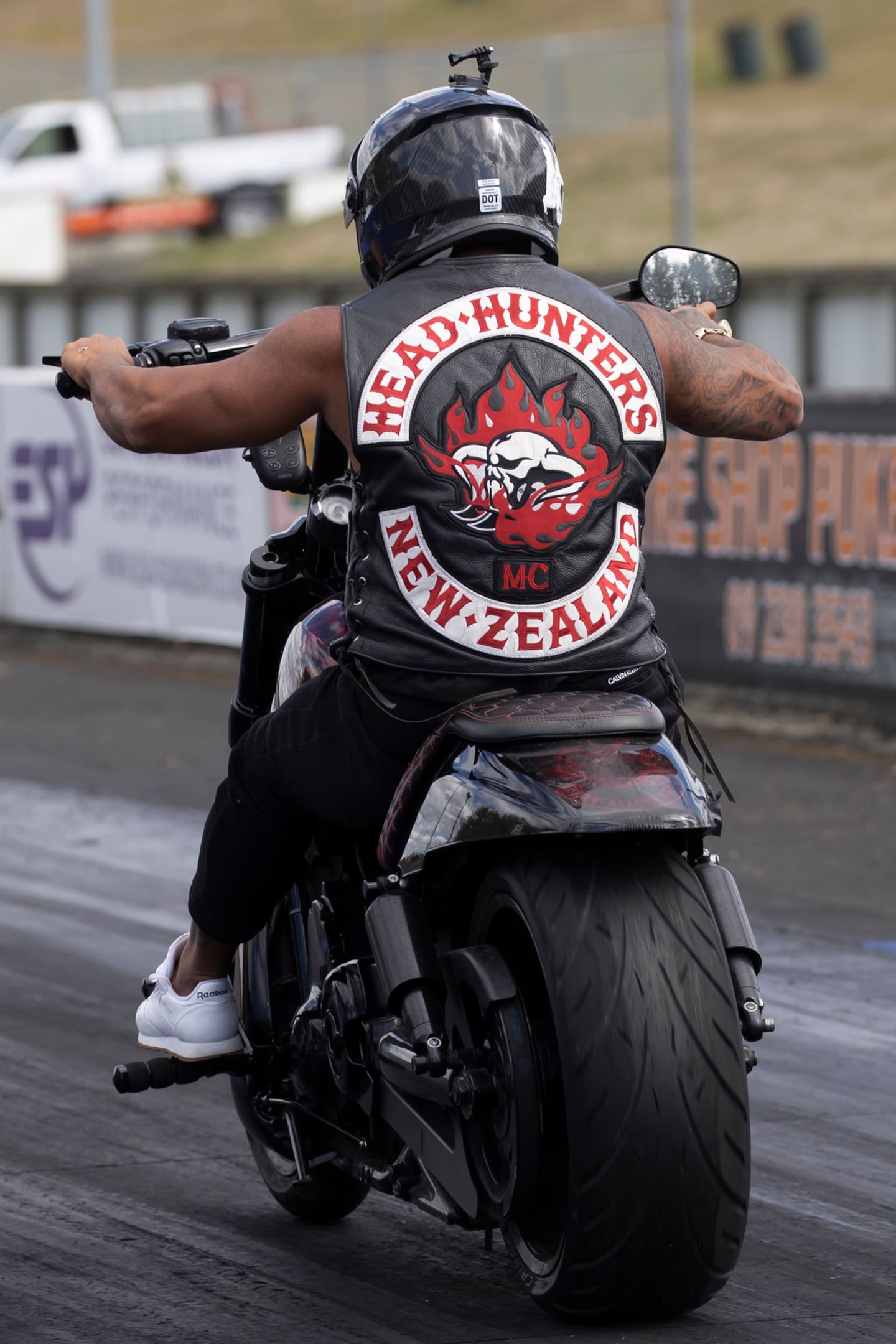 A member of the Head Hunters motorcycle gang does burnouts before a race at Meremere Dragway Meremere. The 2022 race day was organised by the Greazy Dogs. Photo / Brett Phibbs