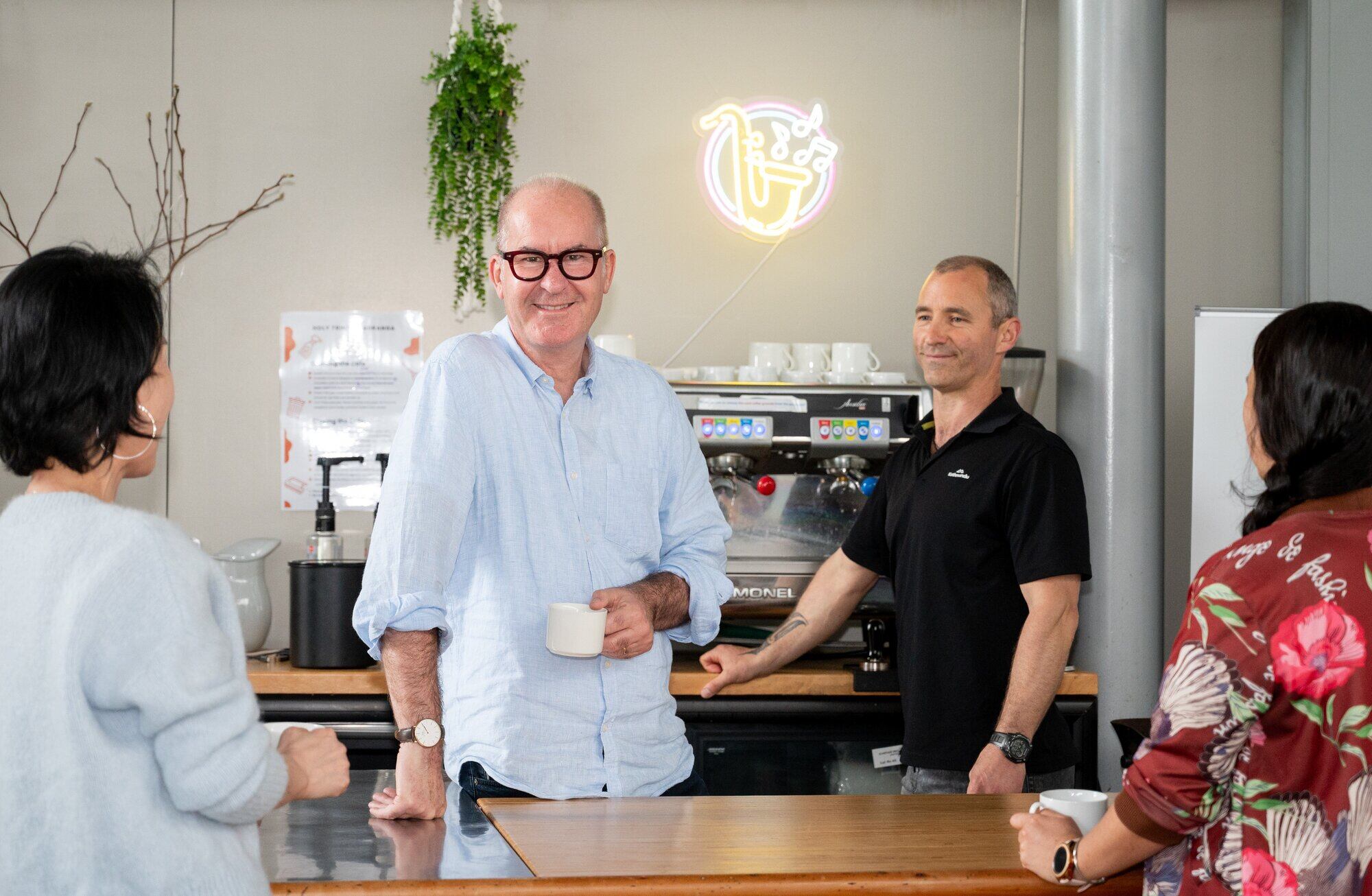 Holy Trinity Tauranga facility manager Jackie Kim, Vicar Nigel Dixon, Vaughan Basanti and Marg Barsanti enjoying a coffee break at the servery which came from the original church.  Photo / Brydie Thompson.