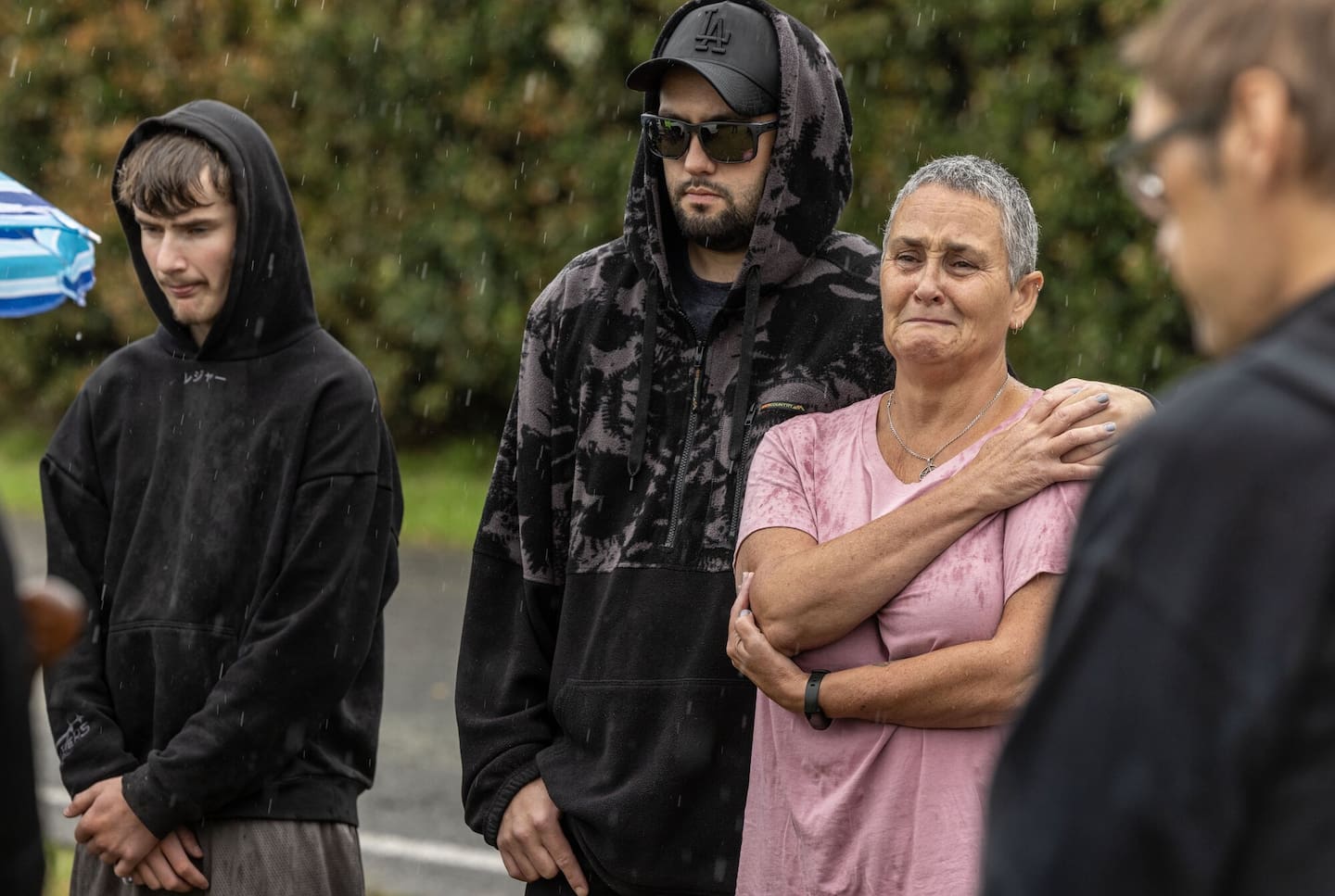 Benjamin Timmins' sister Rachel O'Grady and other family members hold a karakia at the property on Waitārere Beach Rd. Photo / Mike Scott