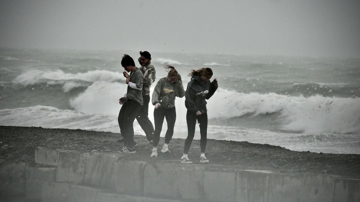 Beachgoers at Westshore Beach during Cyclone Vaianu. Photo / Warren Buckland
