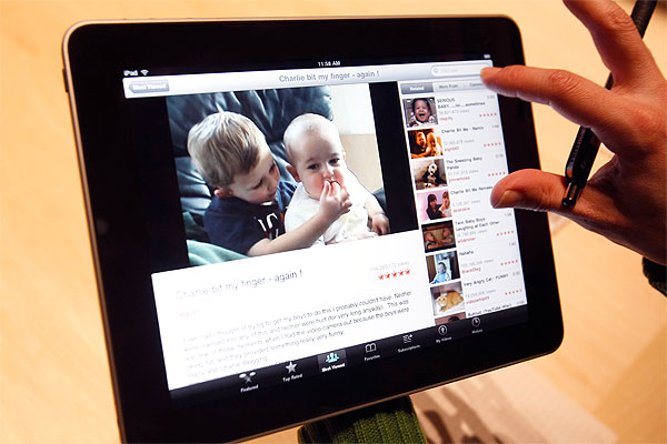 The Apple iPad is examined after its unveiling. Photo / AP