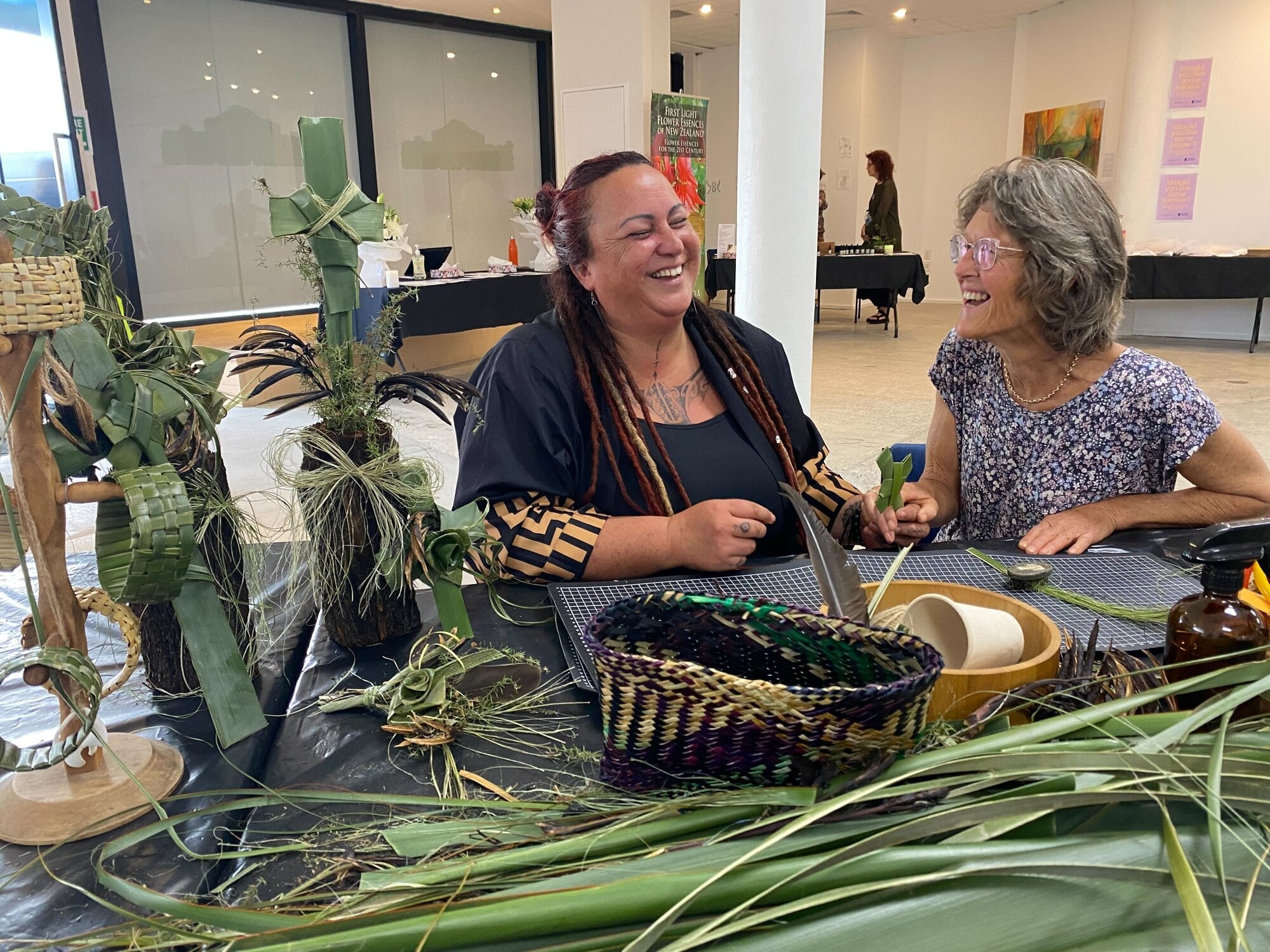 Kalena Egan and Linda Carpenter enjoying a moment while weaving flax at He Maimai Aroha. Photo / Rosalie Liddle Crawford