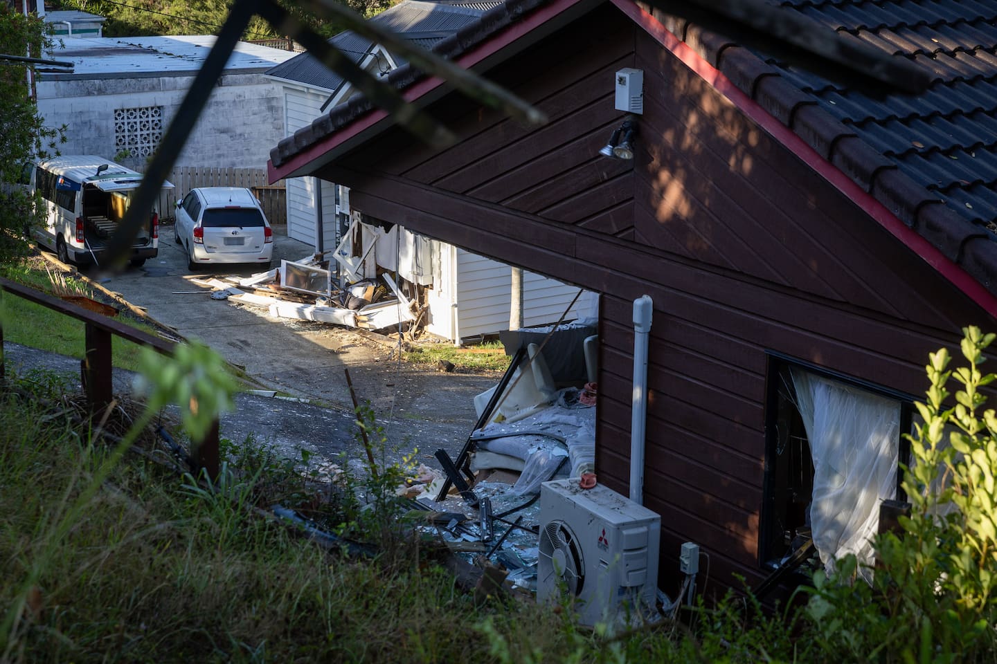 A couple in one of the homes said they narrowly escaped death after they awoke to headlights in their bedroom. Photo / Michael Craig