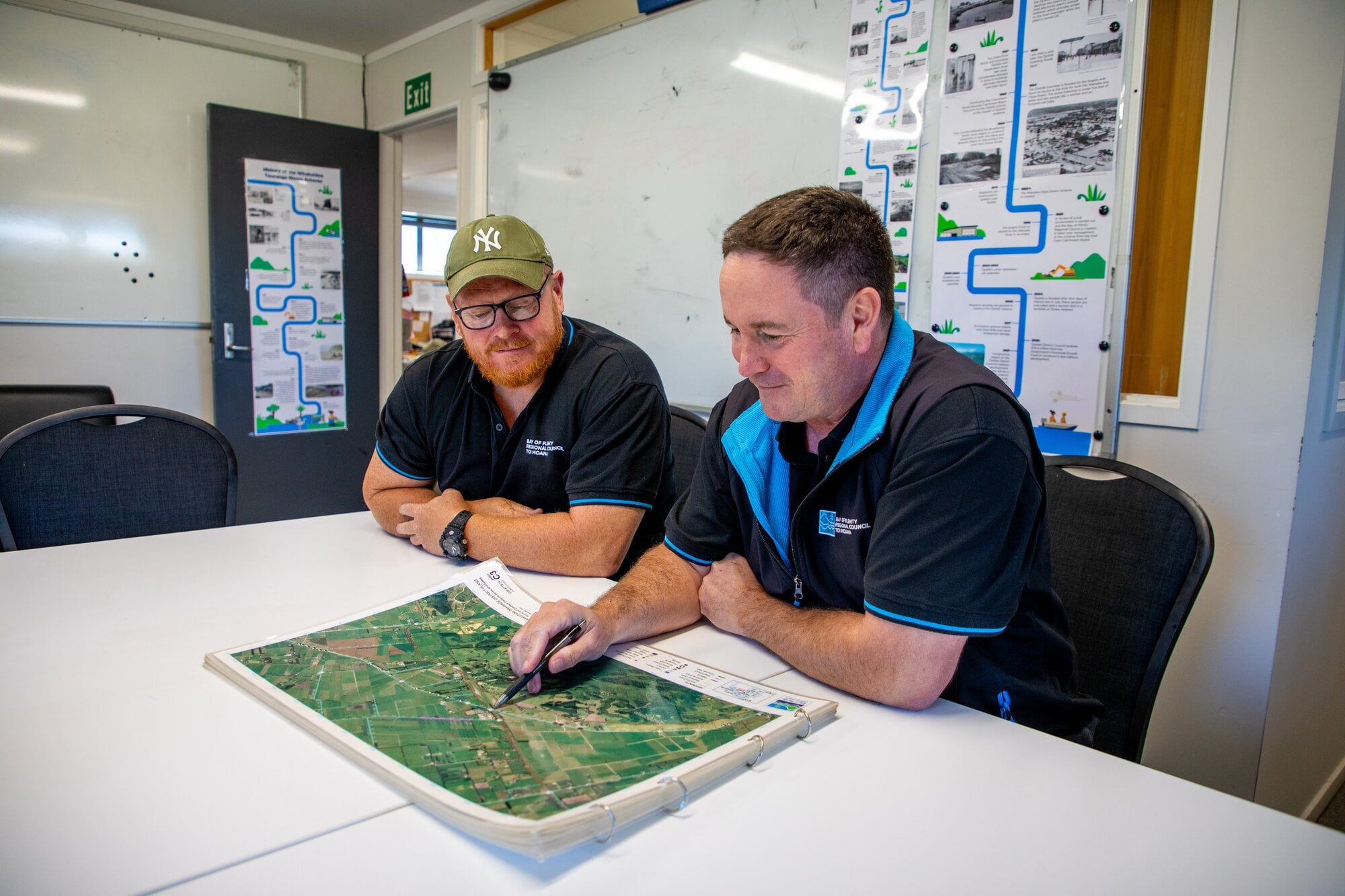  Dan Batten, on right, showing Kerry Smith a map of the Kaituna Control Scheme. Photo / Ross Campbell