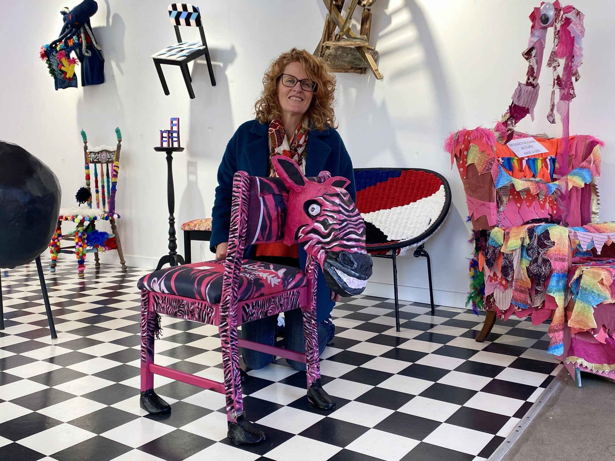  Northern Health School associate principal Robyn Meikle with her pink zebra chair at the All About the Chair exhibition at The Incubator Gallery at Tauranga Historic Village. Photo / Rosalie Liddle Crawford