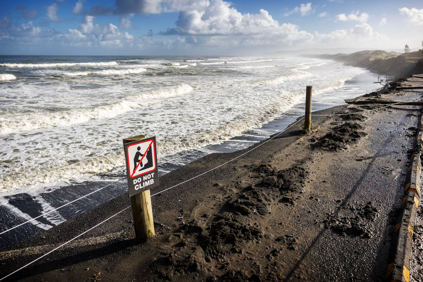 Warning signs at Sunset Beach, Port Waikato. Photo / Mike Scott